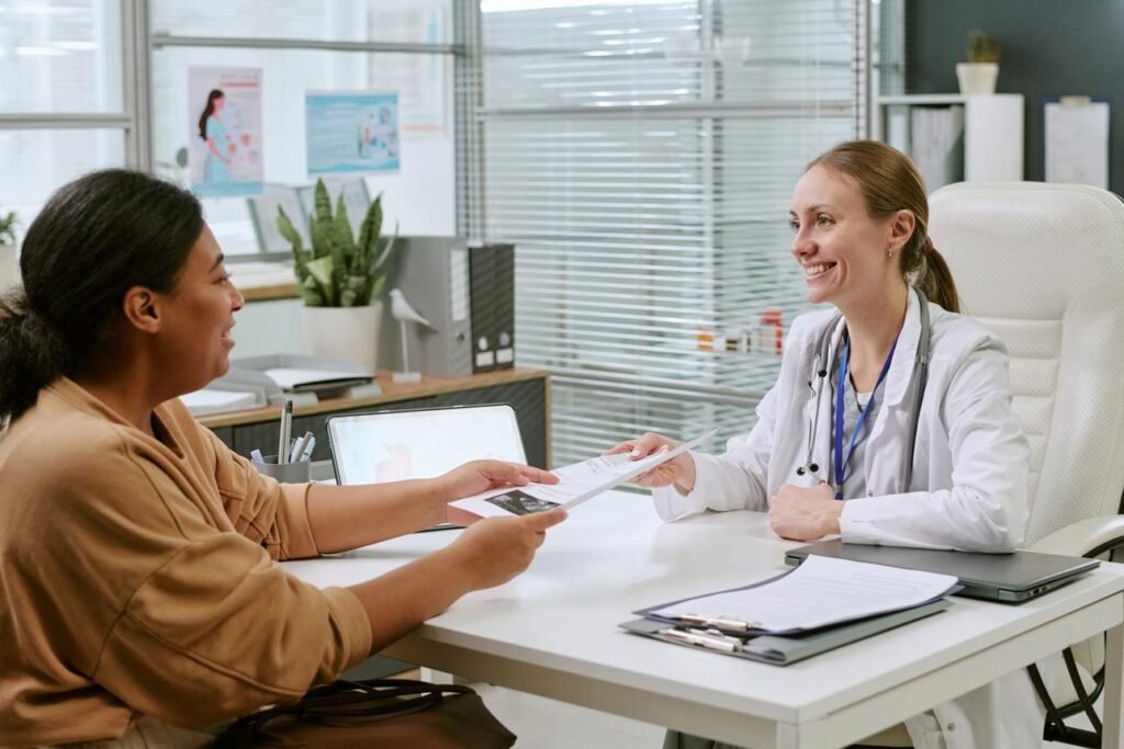 Healthcare professional explaining medication information to a patient